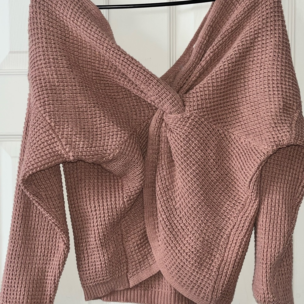 This is a sweater for a nice fall day. It has a cross design in the front!